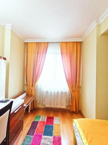 Postel nebo postele na pokoji v ubytování Ceylan Hotel