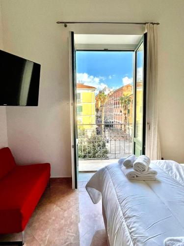 a bedroom with a bed and a sliding glass door at Casa Portanova 35 in Salerno