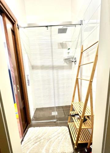 a walk in shower with a glass shower door at Casa Portanova 35 in Salerno
