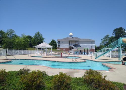a swimming pool with a slide and a playground at Bluegreen Vacations Parkside Williamsburg, an Ascend Collection Resort in Williamsburg