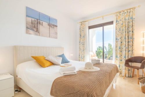 a bedroom with a bed and a large window at Sunrise Golf Paradise 1 - Mijas Golf Spain in Mijas