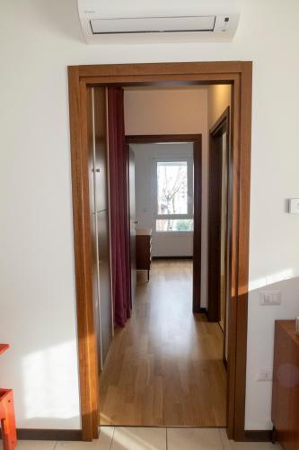 a hallway with a door open to a living room at Bilocale Esperanto in Pianoro