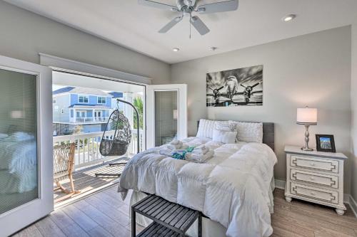 a bedroom with a large bed and a balcony at 3 Decks and Water Views Breezy Home in Hilton Head in Hilton Head Island