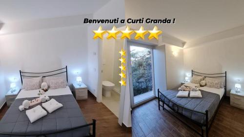 a bedroom with two beds with yellow stars on the wall at Curti Granda in Rescaldina