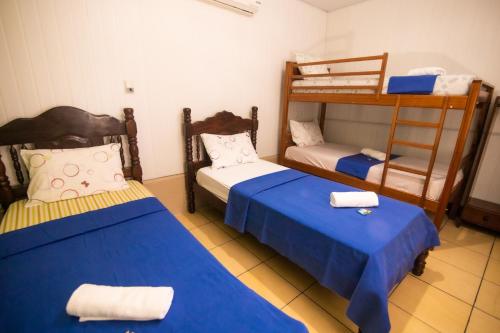 Postel nebo postele na pokoji v ubytování Hotel Coração Verde