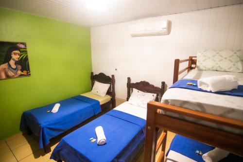 Postel nebo postele na pokoji v ubytování Hotel Coração Verde