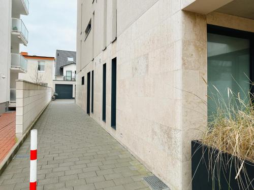 an empty hallway of a building with a sidewalk at Penthouse NorderNice in Norderney
