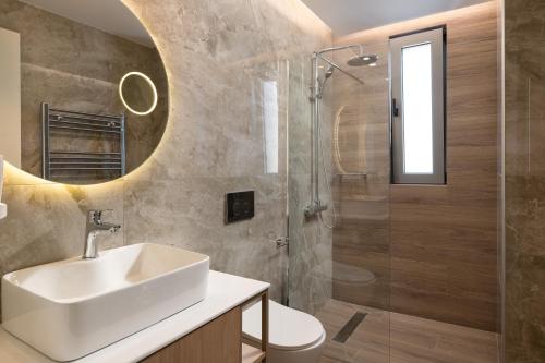 a bathroom with a sink and a shower at ANIMA DEL SOL (BASILICO) in Ixia