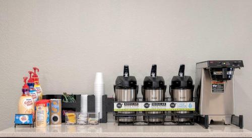 a coffee maker sitting on top of a counter at Red Roof Inn PLUS+ West Palm Beach in West Palm Beach