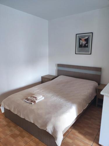 a bedroom with a large bed with a tan blanket at Hawaii Royal Gardens 2 in Limassol