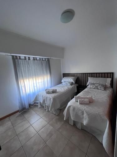 a bedroom with two beds and a window at Luxury Spinetto in Santa Rosa