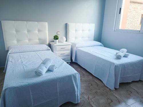 Postel nebo postele na pokoji v ubytování Casa El Rincón de Alberto con Piscina CLIMATIZADA y Calefacción