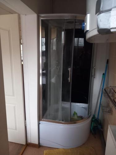 a glass door in a room with a bowl in it at Balvu centrs Partizanu 10 in Balvi