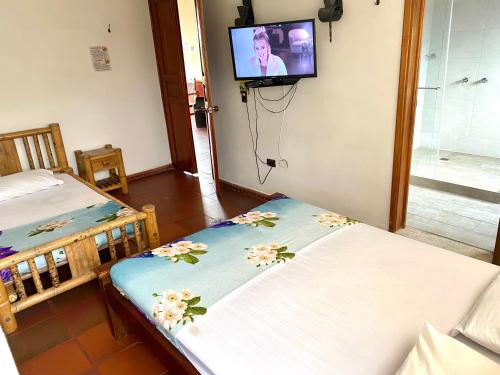 Postel nebo postele na pokoji v ubytování Finca hotel los cocos