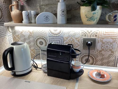 a coffee maker sitting on top of a counter at Casa Charma in Émbonas