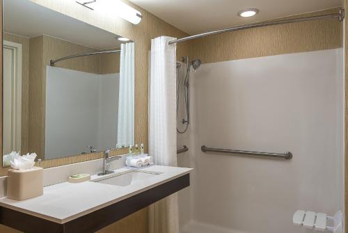 a bathroom with a sink and a shower at Crowne Plaza Princeton, an IHG Hotel in Princeton