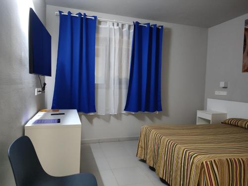 Ένα ή περισσότερα κρεβάτια σε δωμάτιο στο Hotel Blauet by Bossh! Hotels