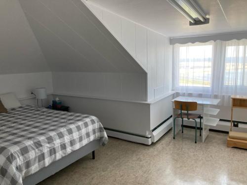 En eller flere senge i et værelse på Le Couvent