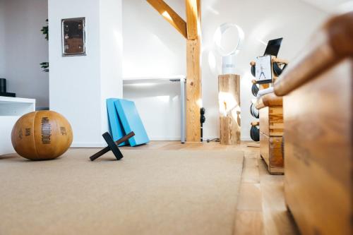 a room with a rug and a cross on the floor at HEIMATEL - Luxury Penthouse Loft in Ravensburg