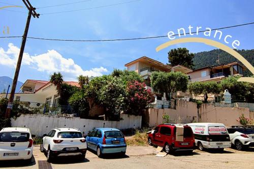 a group of cars parked in a parking lot at K. Villa - Golden Beach in Chrysi Ammoudia