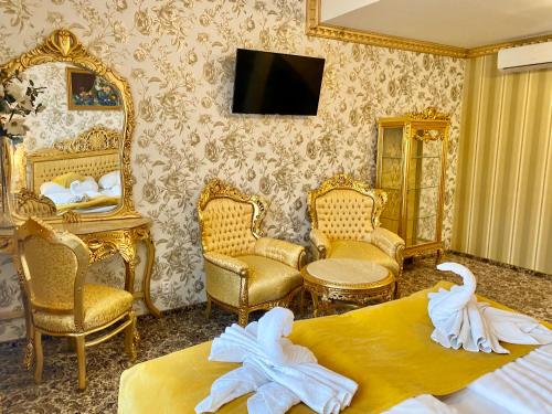 a hotel room with two beds and a mirror at Hotel Liliova Prague Old Town in Prague