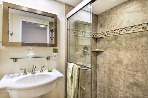 a bathroom with a sink and a shower at Beachfront Lahaina Condo - Featured on HGTV! in Kahana