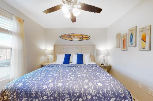 a bedroom with a blue bed with blue pillows at Vinyard Ventures, Unit #3 in Branson