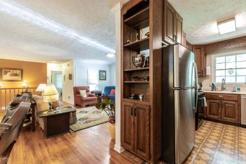 a kitchen and living room with a stainless steel refrigerator at Gail's Gallery in Austell