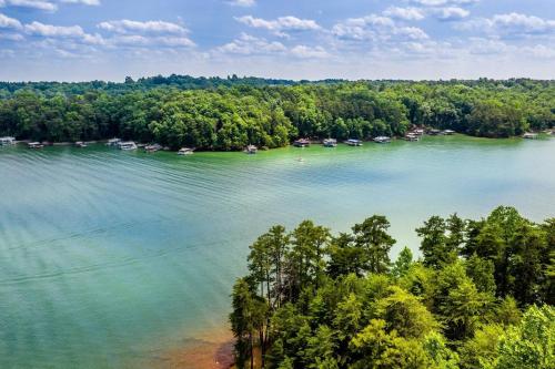 an aerial view of a lake with boats and trees at Gail's Gallery in Austell