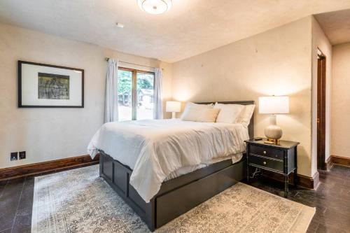 a bedroom with a large bed and a window at Villa Flora in Marietta