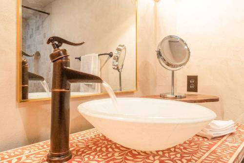 a bathroom with a sink and a faucet at Villa Flora in Marietta