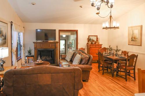 a living room with a couch and a table at Cozy Whittier Home with Fire Pits Less Than 15 Mi to Hiking! in Whittier