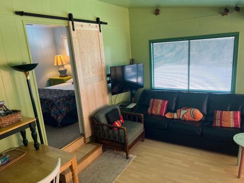 a living room with a couch and a bedroom at Paradise at Canyon Lake in Canyon Lake