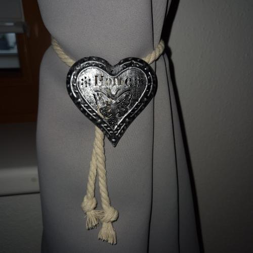 a heart on a rope tied to a girls waist at Apart Pitzenklamm in Arzl im Pitztal