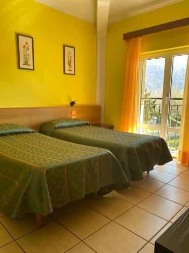 Postel nebo postele na pokoji v ubytování Hotel Del Fiume