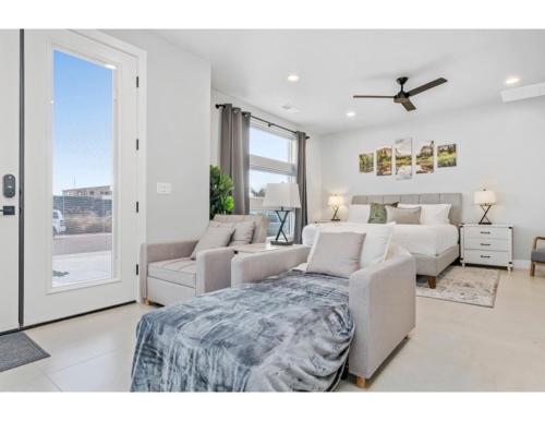 a living room with a bed and a couch at Desert Hideaway in Hurricane