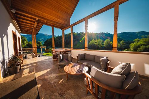 a living room with a couch and a table at Conacul Sanct Gurgh in Cormaia