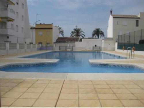 a large swimming pool in the middle of a building at Piso Caleta de Vélez in Caleta De Velez