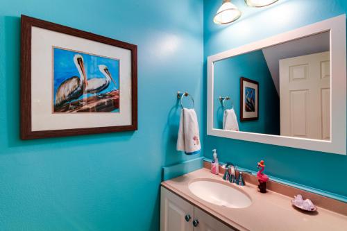 a bathroom with a sink and a mirror at Destin Townhome with Balcony - Walk to the Beach! in Destin