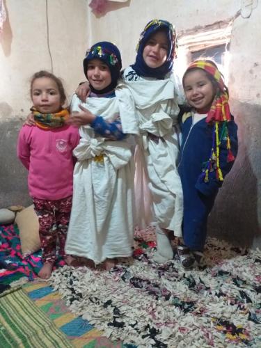 a group of children dressed in costumes posing for a picture at Maison D'hôtes Chez Bassou Agoudal in Agoudal