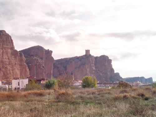 a view of the desert with a mountain in the background at ALBERGUE CASA LAS ANGELITAS in Quel