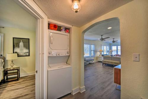 a kitchen with a refrigerator and a living room at Portsmouth Waterfront Vacation Rental with Deck in Portsmouth