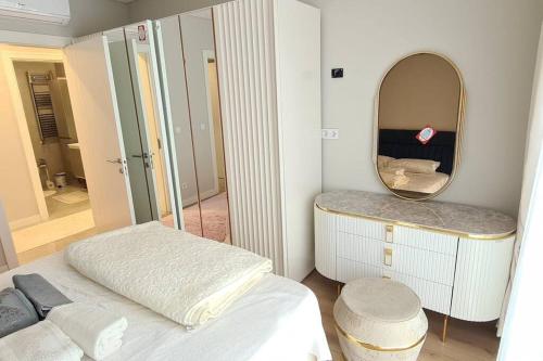 a bedroom with a large mirror and a bed at 2bedrooms 2washrooms with parking. near Starbucks in Istanbul