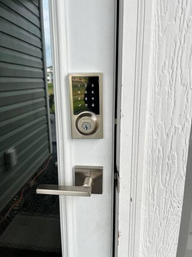 a door with a door knob and a lock on it at Cozy Private 1 bedroom basement suite - free parking and free Wifi in Winnipeg