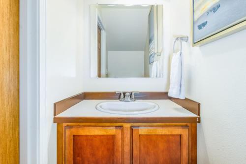a bathroom with a sink and a mirror at Harmony Hills #229 in Anchorage
