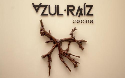 a twig wall art with the yurilra cocora sign at Casa Azulai Puebla Hotel Boutique in Puebla