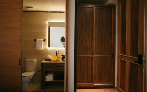 a bathroom with a toilet and a sink at Casa Azulai Puebla Hotel Boutique in Puebla
