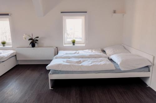 Apartmány Centrumにあるベッド