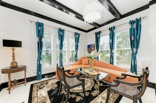a living room with a couch and a table at Prestige Collection, Hotel Boutique in St Petersburg