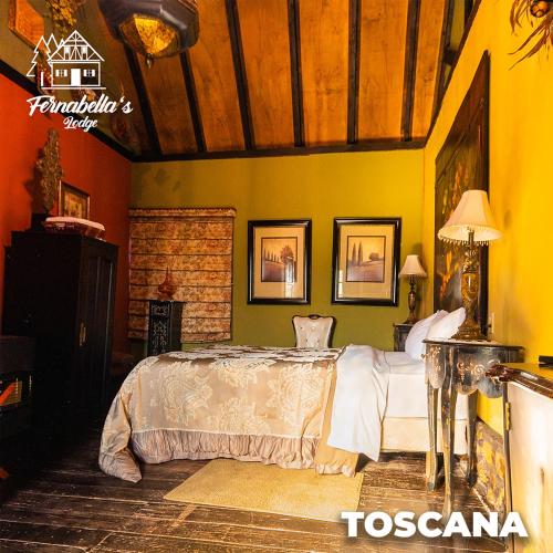 a bedroom with a bed in a room at Fernabella's Lodge in Valle de Guadalupe